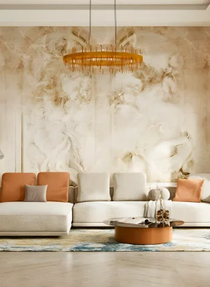 Elegant living room with a large cream sectional sofa, orange and beige cushions, a round wooden coffee table, an ornate wall mural, modern chandelier, potted plant, arched windows, and patterned rug. Residential interior fit out by interioritalia.